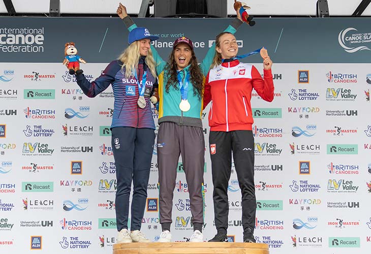 Jess Fox celebrating 10th world title win on the podium.