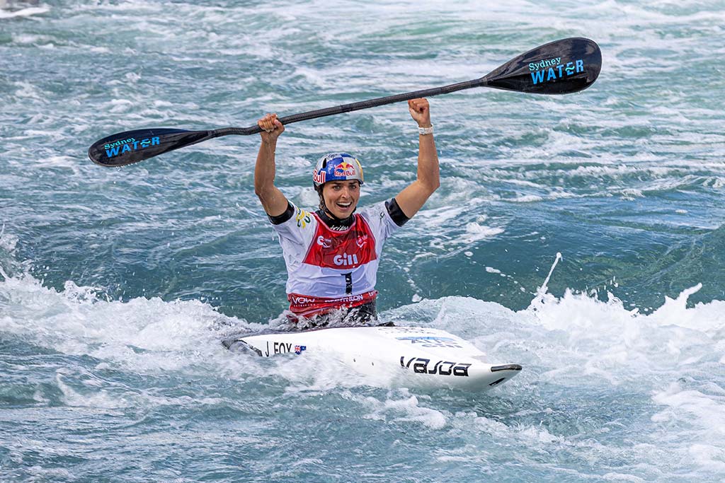 Jess Fox celebrating 10th world title win in the water.