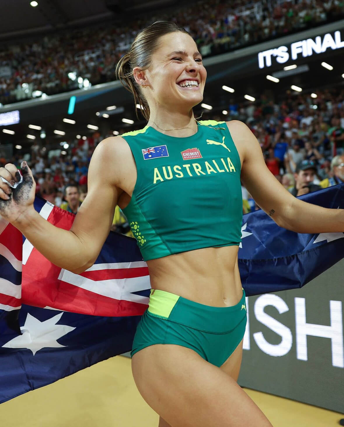 Nina Kennedy celebrating as World Champion wearing Australian flag