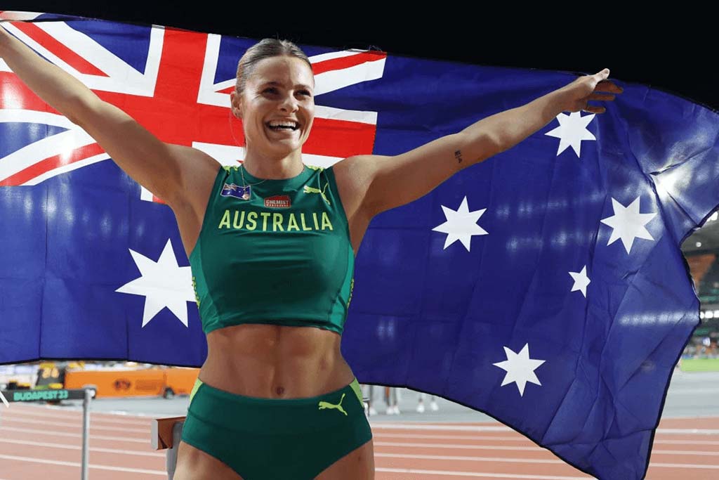 Nina Kennedy holding Australian flag as World Champion
