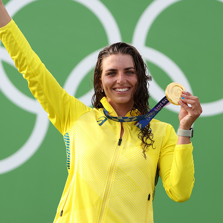 Jess Fox holding gold medal at the Olympic games.